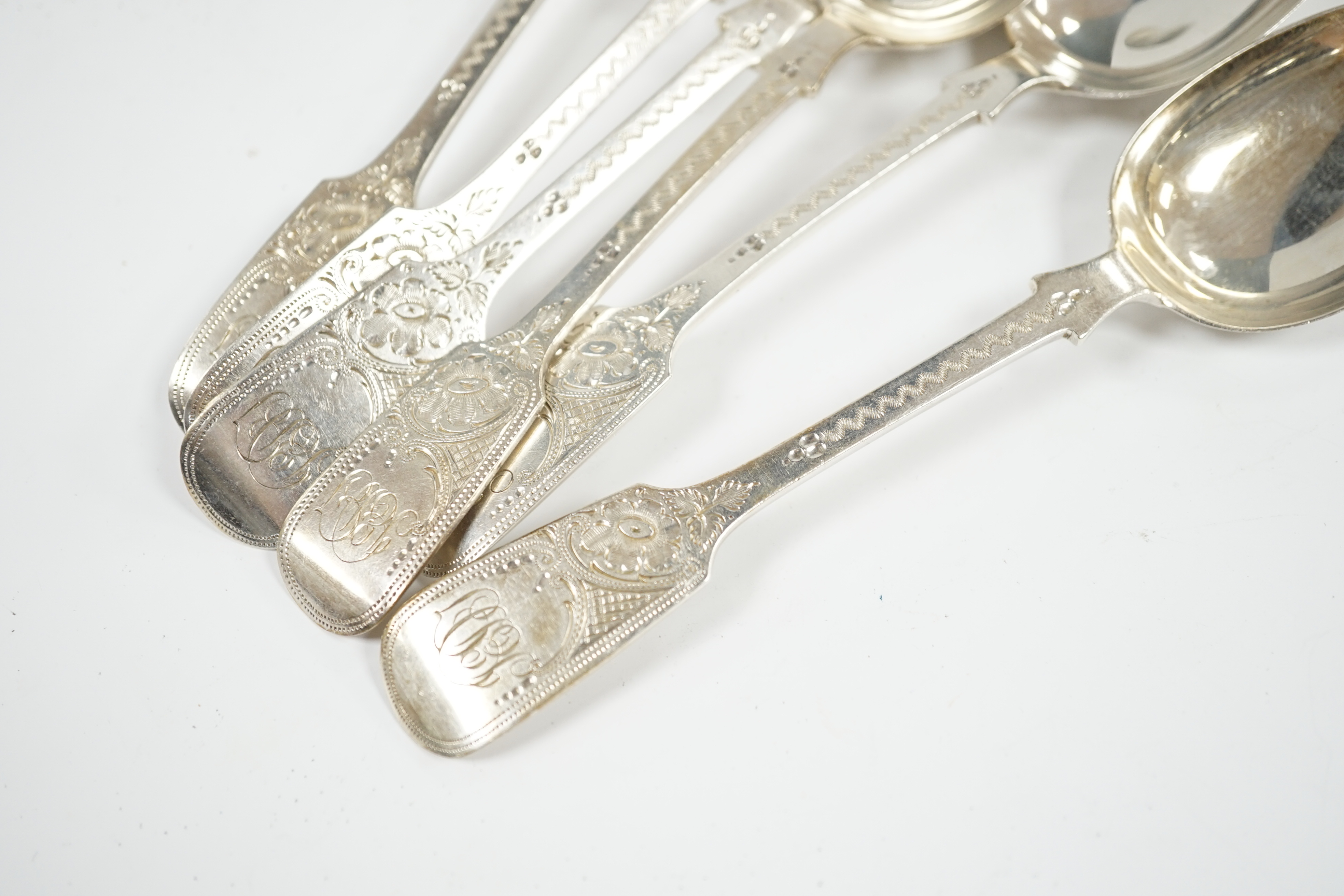 A set of six Edwardian bright cut engraved silver dessert spoons, Charles T. Maine Ltd, London, 1909, 17cm, 7.8oz. Condition - fair